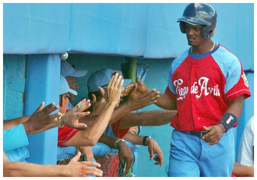 Cuban baseball team players Jose Abreu and Rudy Reyes celebrate