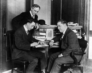 Jack Barry and Harry Frazee: Red Sox player-manager, left, signs his 1917 contract as owner Frazee looks on.