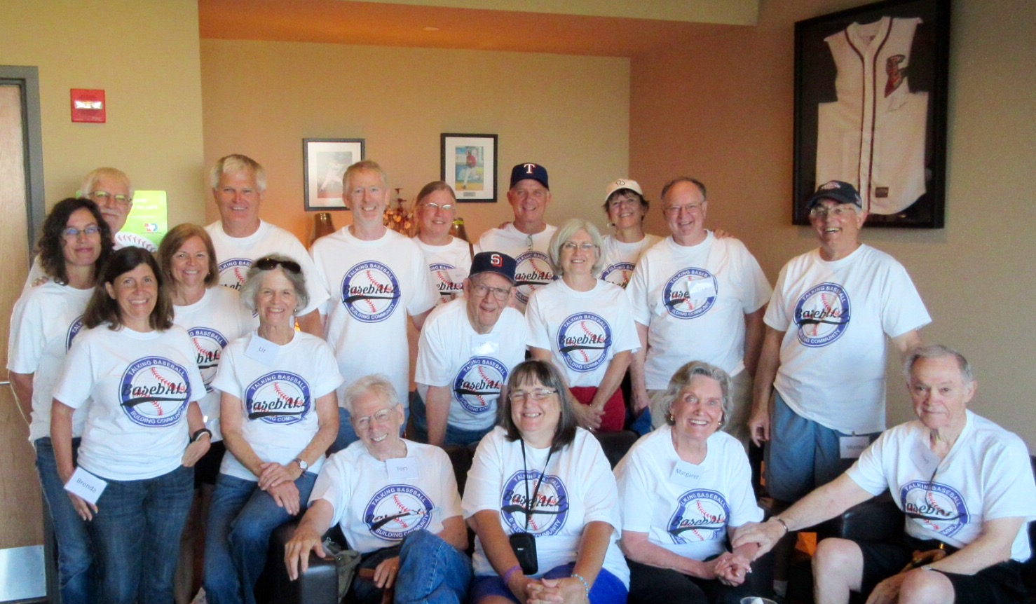 Participants, caregivers, volunteers, and spouses from the new BasebALZ program attend a baseball game on August 3, 2015, at Dell Diamond in Round Rock, Texas.